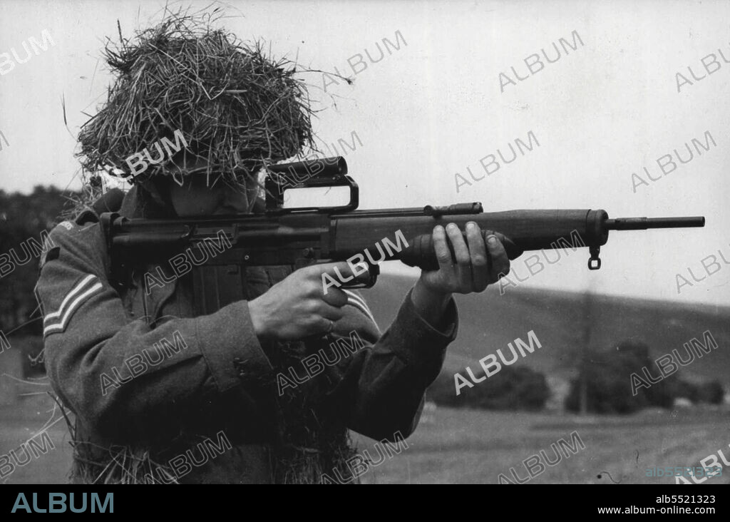 The New British Rifle: A corporal at the school of infantry at Warminster, Wiltshire, demonstrating the new E.M.2 self-loading rifle. 
Representatives from many countries including Military Attaches and officers of the new British Army saw a demonstration of the new British weapons - the E.M.2 self-loading rifle. The new rifle-much favoured by the British Government - fires .208 calibre ammunition and is nealy one pound lighter in weight that the present standard British. 303 Lee Enfield rifle. August 11, 1951.