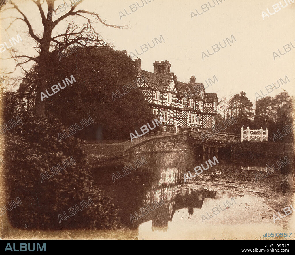 Pitchford Hall, Sussex, Robert Henry Cheney, ca. 18001866, British, ca. 1853, Albumen print from waxed paper negative on thin, smooth, cream wove paper, Sheet: 7 × 8 5/8 inches (17.8 × 21.9 cm) and Mount: 10 1/8 × 12 inches (25.7 × 30.5 cm), architectural subject, bridge (built work), building, landscape, moat, England, Sussex, United Kingdom.
