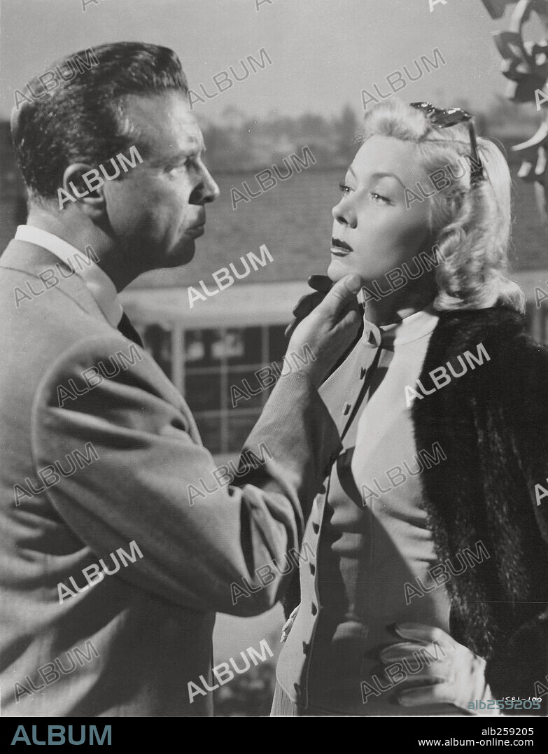 DICK POWELL und GLORIA GRAHAME in THE BAD AND THE BEAUTIFUL, 1952, unter der Regie von VINCENTE MINNELLI. Copyright M.G.M.