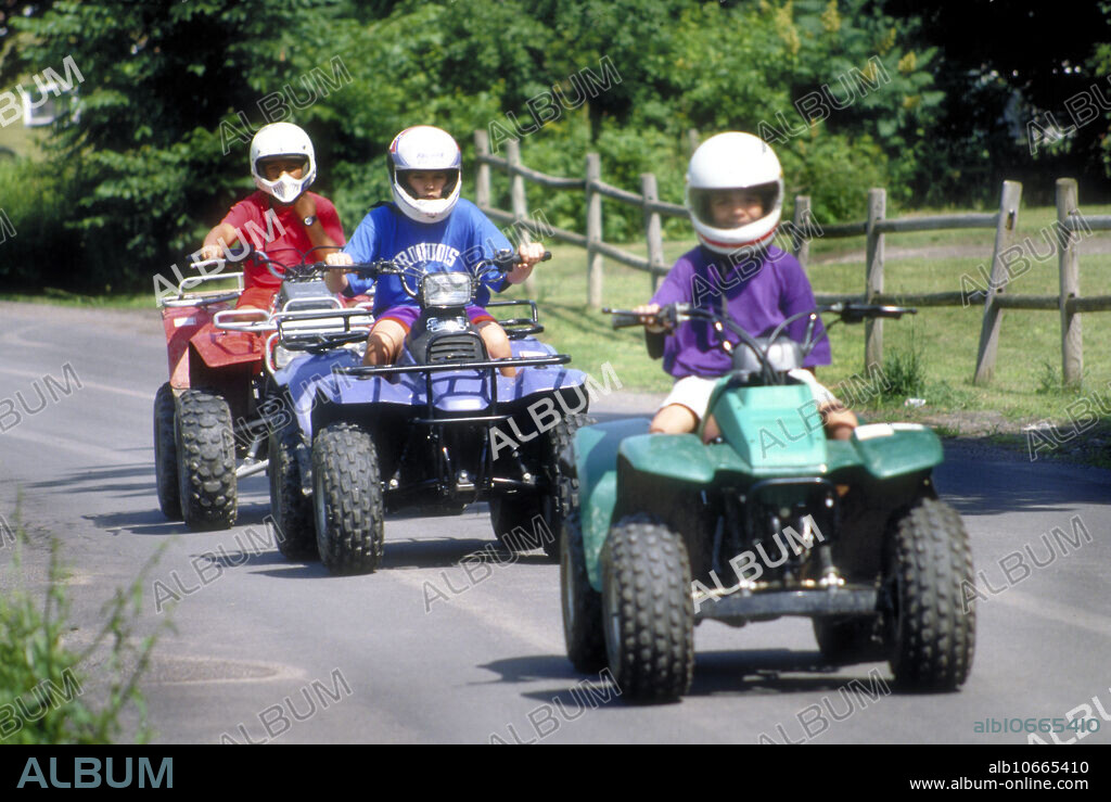 Onondaga Iroquois boys driving their off-road vehicles on the reservation, Nedrow, New York.