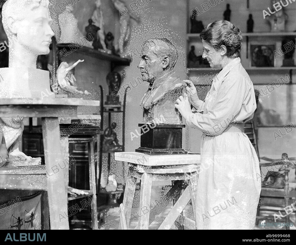 A new series of photographs of Lady Hilton Young at work in her studio in Bayswater . Lady Hilton Young was the widow of Captain Robert Falcon Scott, the antarctic explorer. 26 March 1931.