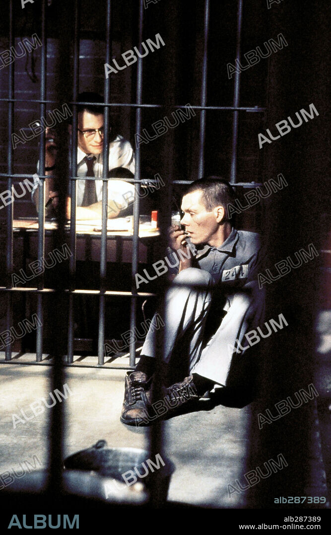 CHRISTIAN SLATER and KEVIN BACON in MURDER IN THE FIRST, 1995, directed by MARC ROCCO. Copyright WARNER BROS.
