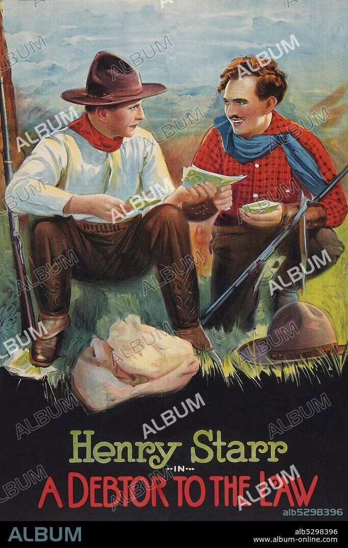 Two cowboys split cash apparently taken in a robbery.  Poster for A Debtor to the Law (1919).  Henry Starr (1873–1921) was an American criminal of the wild west and an American actor of the silent film era..