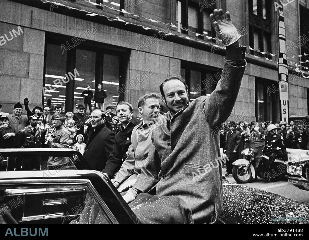 Apollo 14 astronauts (left to right) Alan Shepard, Stuart Roosa and Edgar Mitchell wave to an enthusiastic crowd, Chicago, 1971.