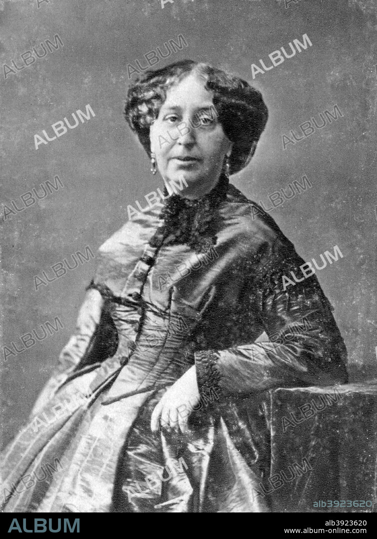 George Sand, French novelist and early feminist, c1845-1876. Portrait of Amandine Aurore Lucie Dupin whose pen-name was George Sand (1804-1876). Married at 18, after nine years she left her husband Baron Dudevant and went to Paris with their two children. A member of the Bohemian artistic circle, Sand took a number of lovers including Jules Sandeau, Prosper Merimee, Lamenais and Pierre Leroux. Her most famous relationship was that with Chopin which lasted 10 years. From 1848 she lived at Nohant in Berri, France, a property she inherited from her grandmother. A photograph from Album de Photographies, Dans L'Intimite de Personnages Illustres, 1845-1890, Editions MD, 22 Rue de L'Arcade, Paris 8, 1845-1890.