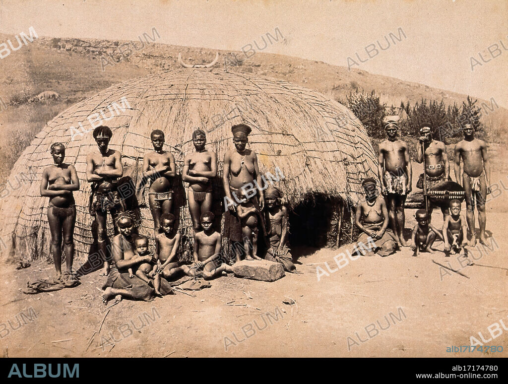 South Africa: Africans in front of a traditional kraal hut, between 1800 and 1899.
