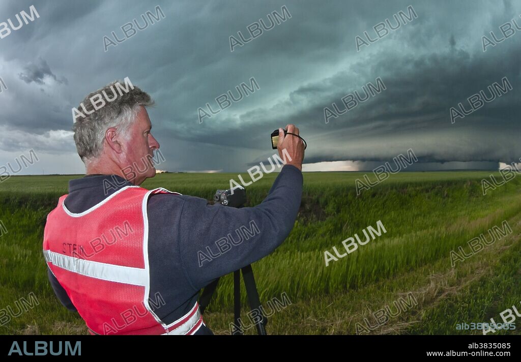 Tornado researcher Herbert Stein photographs an approaching supercell thunderstorm in western Nebraska on June 6, 2010.