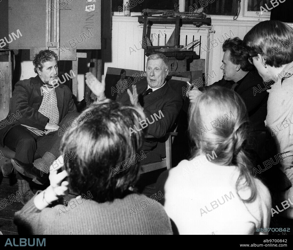 Artist L S Lowry visiting the College of Art , Maidstone , kent to talk to young art students. He has been working with Mervyn Levy (who teaches at Maidstone ) on a book about himself. Photo shows: Mr Lowry expressing his views on what the young painter should do - or not do. On the left is Mervyn Levy . 24 January 1961.