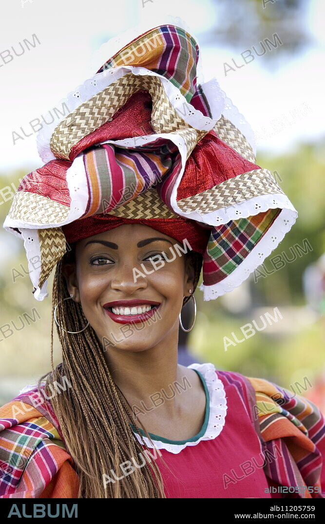 Woman wearing Jamaican national costume for cultural display at Governor General's Residence, Kings House, Kingston, Jamaica.