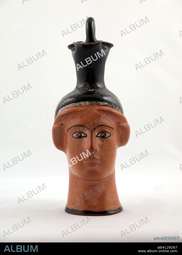 ANCIENT GREEK. Oinochoe (Pitcher) in the Shape of a Female Head. Greek; Athens; Attributed to the Canessa Class. Date: 450 BC. Dimensions: 14 × 6.7 × 8.9 cm (5 1/2 × 2 5/8 × 3 1/2 in.). Terra-cotta, decorated in the red-figure technique. Origin: Athens.