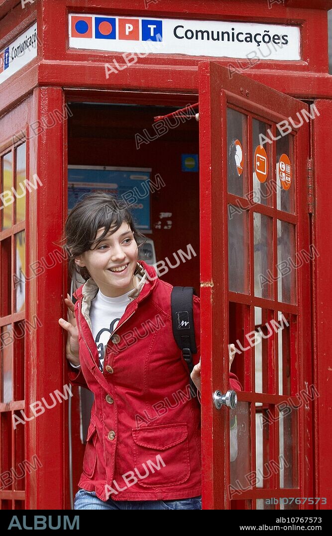16 year old girl in phone booth, Porto. Portugal.