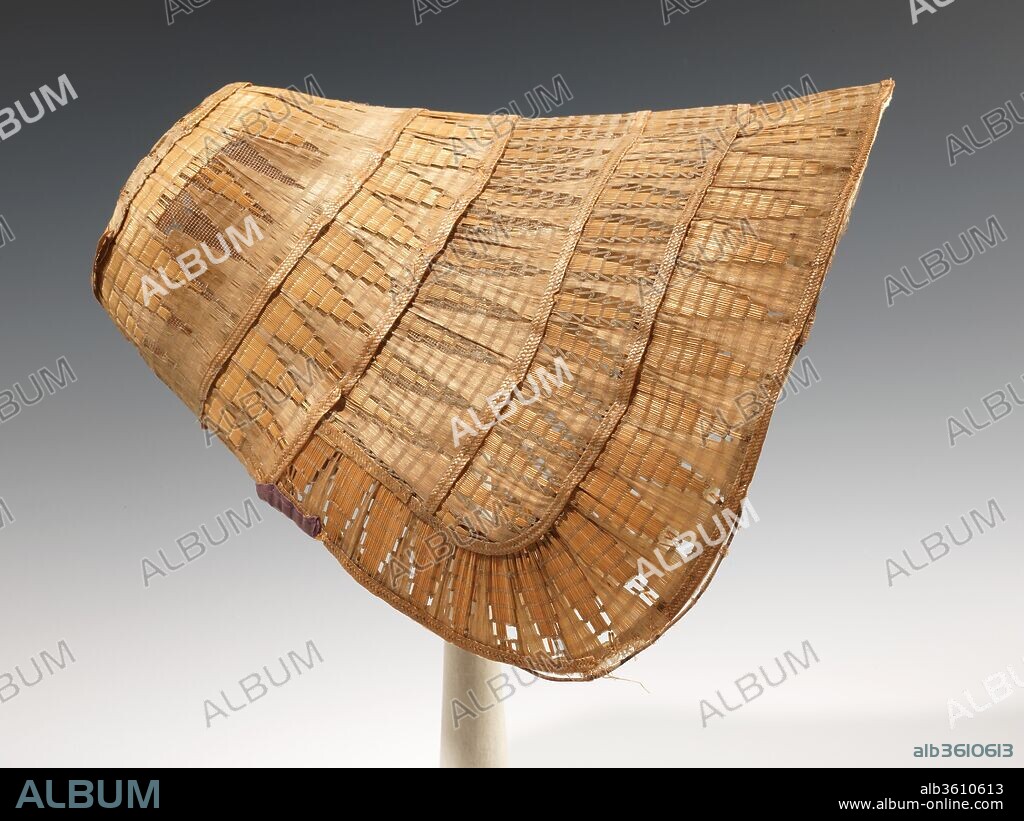 Poke bonnet. Culture: American. Date: ca. 1835.
Because of its inherent fragility, the intricate fancy weave worked on this bonnet is rare, as examples like this usually do not survive. The striking color and design of the straw added an additional decorative touch to the bows, corsages, and ruffles that would have originally decorated the bonnet.