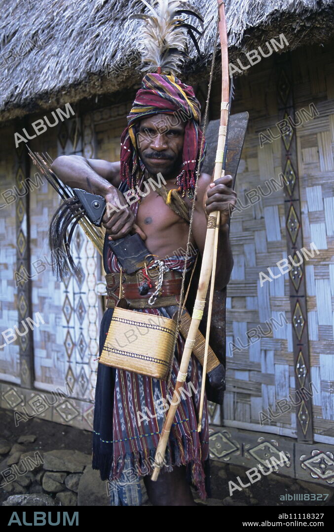 Abui tribal headhunter in warrior dress, Alor Island, eastern area, Indonesia, Southeast Asia, Asia.