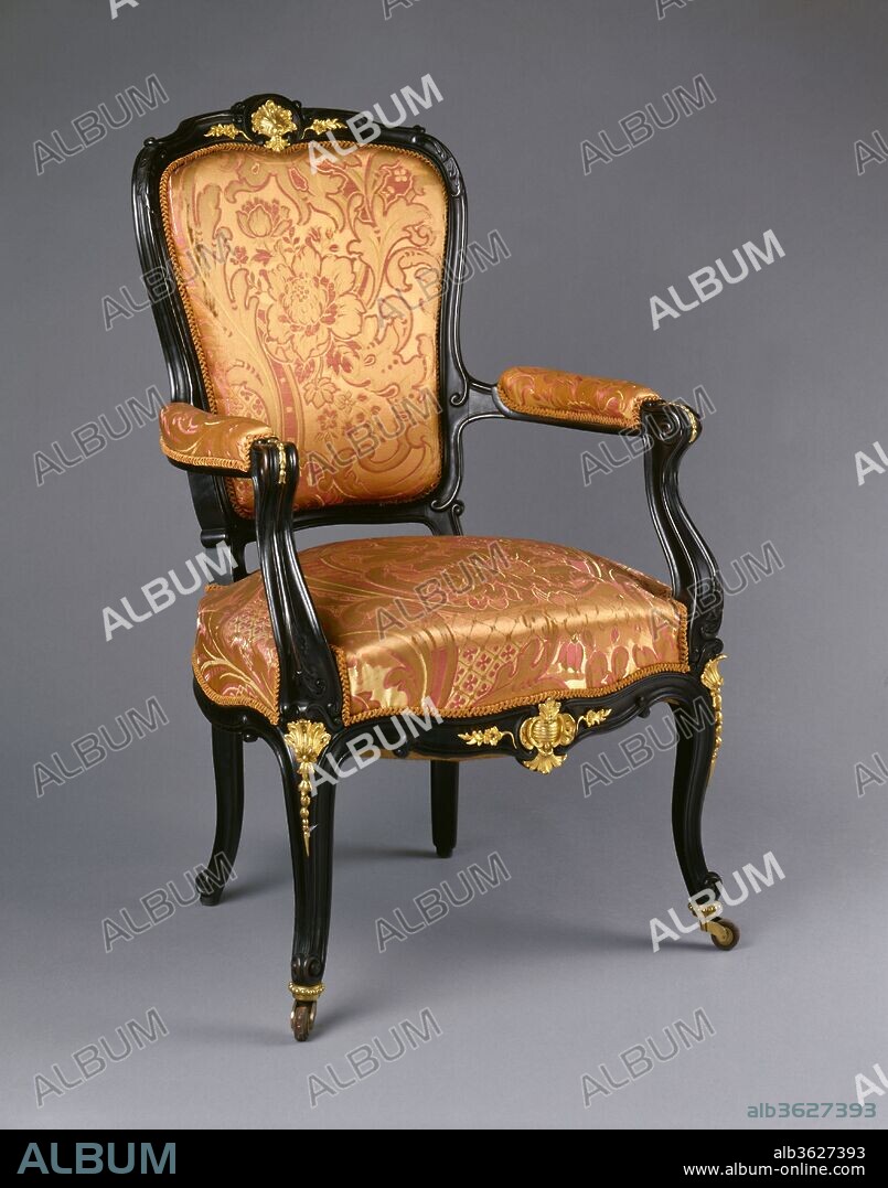Armchair. Culture: American or French. Dimensions: 38 1/2 x 23 1/4 x 26 1/8 in. (97.8 x 59.1 x 66.4 cm). Maker: Auguste-Émile Rinquet-Leprince (1801-1886). Date: ca. 1843.
In the 1840s, many well-to-do New Yorkers preferred French furniture to that made in their native city. In 1844, Mrs. Samuel Jaudon of New York wrote to her friend Mrs. James C. Colles that "we on this side feel as if everything [is] so much handsomer, and better, and desirable that comes from Paris." Upon orders from New York clients, Parisian cabinetmaker and decorator Ringuet-Leprince shipped entire rooms of furniture, carpets, looking glasses, wallpapers, decorative objects, and sculpture. This armchair is part of a formal drawing room suite that was custom-made by Ringuet-Leprince as part of a suite for the abovementioned Colles family. The suite includes a pair of sofas, four armchairs, four side chairs, a firescreen, and a table (see 69.262.1-10). In 1850, the Colles' daughter, Frances, married John Taylor Johnston, a New York railroad executive who later served as the first president of The Metropolitan Museum of Art from 1870 to 1889. The suite of furniture descended in the family, original upholstery intact, and, except for two armchairs, was given to the Museum in 1969.