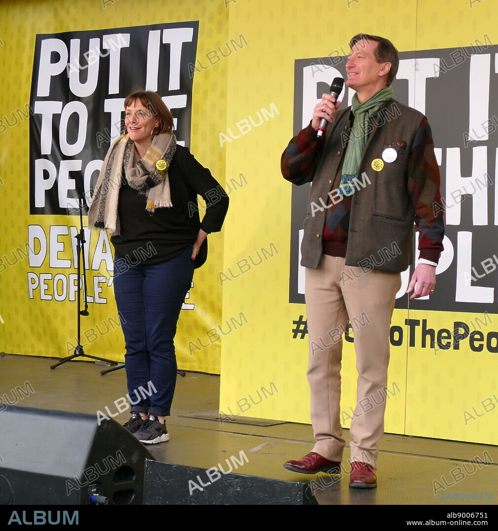Jess Phillips, Labour Member of Parliament (MP) for Birmingham Yardley, watches as Dominic Grieve, British Conservative politician, addresses the 'People's Vote' march in Parliament Square, London. The People's Vote march took place in London on 23 March 2019 as part of a series of demonstrations to protest against Brexit, call for a new referendum, and ask the British Government to revoke Article 50. It brought to the capital hundreds of thousands of protestors, or over a million people according to the organizers.