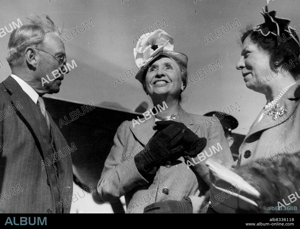 Helen Keller here. ***** famous deaf, dumb and blind authoress Helen Keller is greeted on the gangway of the ANA Skymaster by, Mr. Justice Maxwell, president of the Royal Sydney Industrial Blind Institution, on her arrival from America today. Miss Keller is accompanied by her secretary, Miss Polly Thompson. March 29, 1948.
