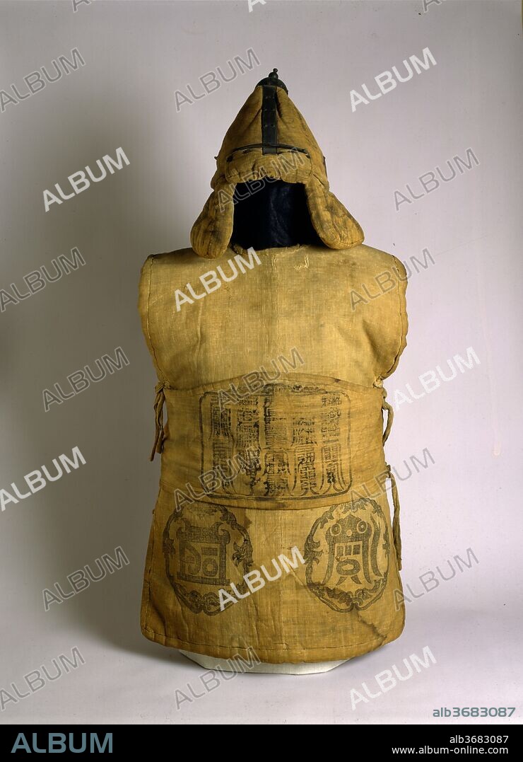 Fabric Armor and Helmet with Buddhist and Taoist symbols. Culture: Korean. Dimensions: H. as mounted with helmet 47 3/4 in. (121.3 cm); W. as mounted with helmet 22 in. (55.9 cm); H. of armor as mounted 33 1/16 in. (84 cm); W. of armor as mounted 22 1/16 in. (56 cm); D. of armor as mounted 13 in. (33 cm); Wt. 18 lb. 14 oz. (8575 g); H. of helmet 16 1/2 in. (42 cm); W. of helmet 11 13/16 in. (30 cm); D. of helmet 13 in. (33 cm); Wt. of helmet 4 lb. 2 oz. (1869 g); Wt. of torso 13 ob. 11 oz. (6207 g); Wt. of belt 1 lb. 1 oz. (499 g). Date: possibly 18th century.
Various types of textiles have long been used as the basis for armor in many different cultures. By far the most typical method for utilizing cloth for armor involved forms of quilting. Quilted armor generally consists of an envelope of fabric that is stuffed with a shock-absorbing padding, which is stitched in place. Far more unusual is armor made up of layered fabric. The defensive quality is achieved by placing many sheets of cloth one atop another so that the material is thick enough to absorb a blow, deflect an edge, or turn away a point, while still allowing relative freedom of movement. Both methods are employed, although layering predominates, in this very rare fabric armor from Korea, the strength of which is spritually augmented by a series of pretective Taoist and Buddhist symbols.
The tunic of this armor is composed of thirty layers of a tough cotton fabric, skillfully cut and sandwiched together with hemp stitching to give an overall thickness of less than one inch. The brim, earflaps, and neck flap of the helmet are quilted in a conventional manner. The helmet is reinforced by a finial with four radiating bands made of tinned iron. Written in ink inside the tunic and the helmet are the names of three members of the Kim family, who presumably once used the armor.
The most prominent decorative feature of this armor is the series of five Taoist symbols stamped in ink at the front and rear of the skirts, at the shoulder blades of the tunic, and on the earflaps and neck flap of the helmet. These represent the Wu-yüeh (Five Mountains), which were revered as having the power to maintain universal peace and stability and to influence the destiny of humanity. Each symbolic mountain was associated with one of the five directions--North, South, East, West, and Central--and with a particular existing mountain. Over time, however, the direction and the mountain with which each symbol was identified changed repeatedly. As amulets the symbols, with their associated directions and mountains, had specific protective powers that were especially appropriate when used in the decoration of armor. The Eastern Mountain guaranteed long life, the Southern Mountain protected from harm by enemies or by fire, the Central Mountain gave relief from fatigue, the Western Mountain ensured against injury by the sword, and the Northern Mountain safeguarded against the perils of water, such as drowning or shipwreck. Also Taoist are the five columns of fu-lu, magical talismans in the form of stylized Chinese characters, that appear on the front of the waistband. They are believed to have the power to ward off evil spirits and to give protection from various types of harm or misfortune.
The decoration of this armor invites further divine protection through a Buddhist invocation, which is repeated four times on the helmet and once on the rear of the waistband. The invocation consists of six characters in Siddham, one of the Sanskrit-derived alphabets reserved for sacred literature in China, Korea, and Japan. It is the mantra, Om Mani Padme Hum.