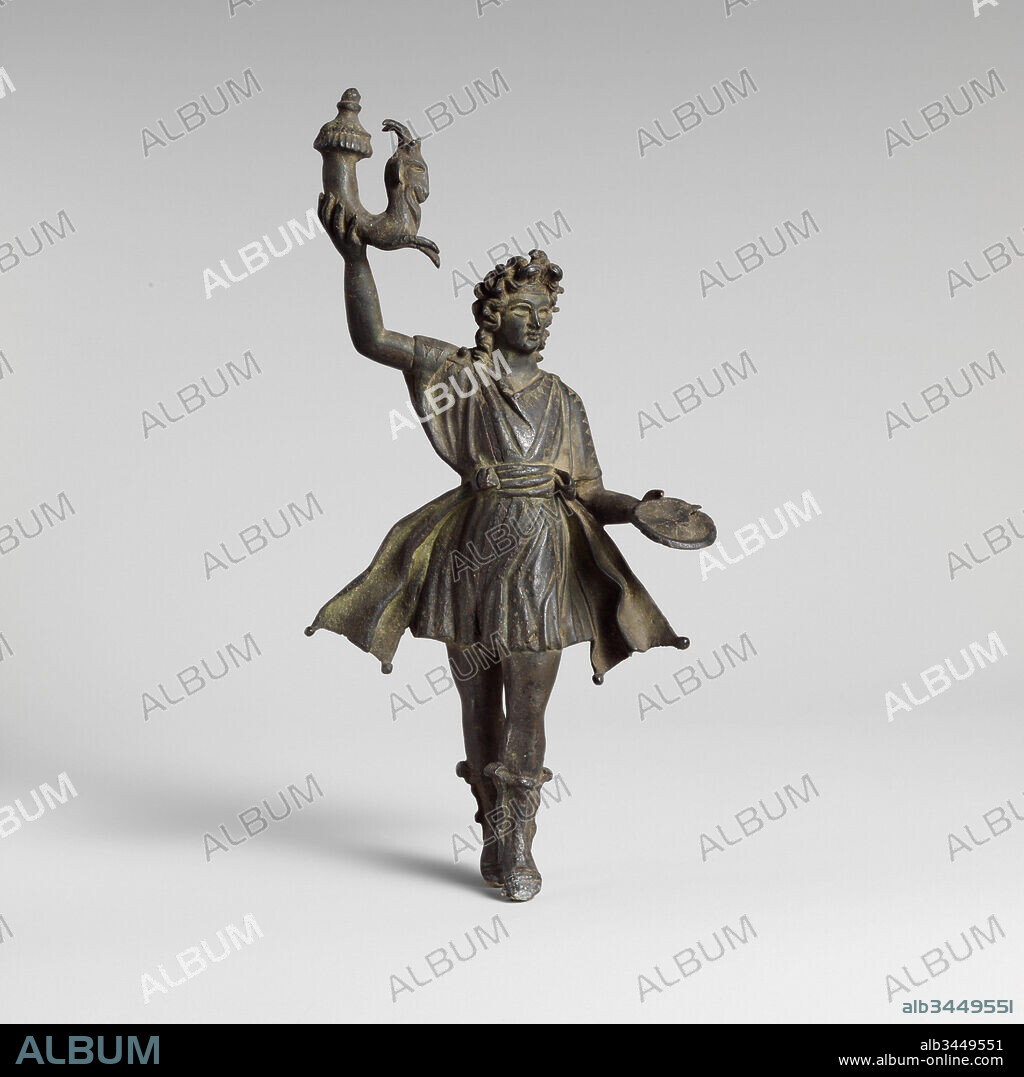 Bronze statuette of a Lar, Imperial, 1st–2nd century A.D., Roman, Bronze, Overall: 9 3/4 x 4 9/16 x 2 1/8 in. (24.8 x 11.6 x 5.4 cm), Bronzes, The lar familiaris was a household deity that protected the members of the family, ensuring their health and prosperity. From the time of Augustus onward, the lararium (a small shrine found in every Roman house) contained two lares, each with the same attributes of a rhyton (drinking vessel) and patera (offering dish).