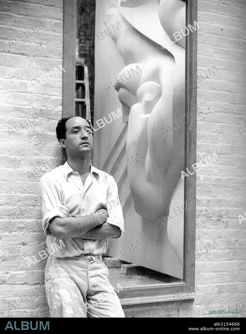 New York, New York:  1940 Isamu Noguchi with a reflection of the Associated Press Building Plaque, which was carved in plaster and cast in stainless steel - at that time the largest-ever stainless steel casting.  It is still installed in Rockefeller Center.