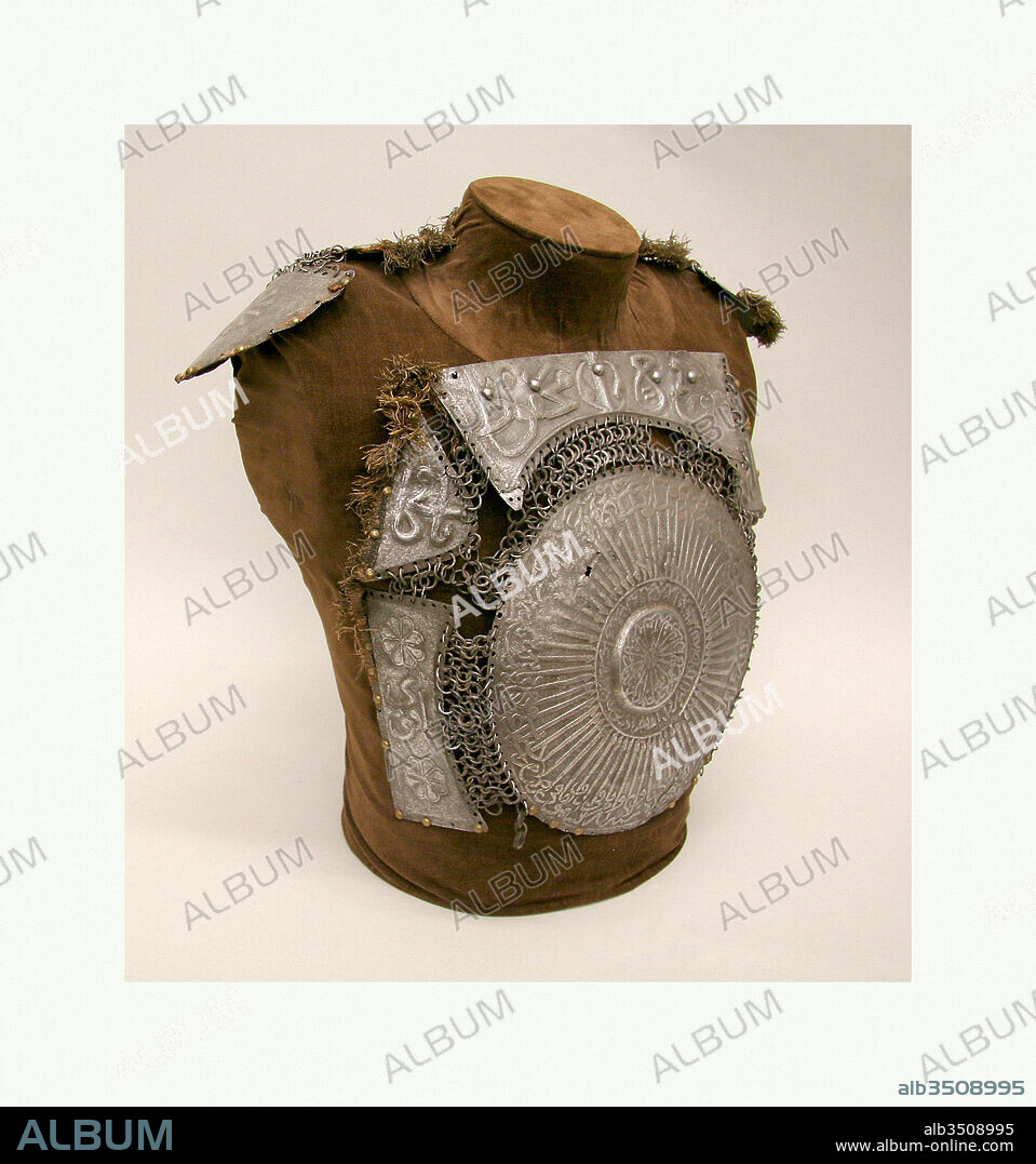 Portions of a Cuirass, late 16th–17th century, Turkish, Steel, iron, copper alloy, textile, Breastplate: 14 1/8 x 18 1/8 in. (36 x 46 cm); Diam. of center disc (min) 10 7/8 in. (27.61 cm); Diam. of center disc (max) 11 1/8 in. (28.24 cm); Shoulder defense: 4 1/8 x 19 7/8 in. (10.5 x 50.5 cm), Armor Parts-Backplates, Armors with circular breastplates appeared in the Middle East in the late fifteenth century and were used by the Ottoman heavy cavalry throughout the sixteenth century. This example has plates embossed in high relief lettering with several different verses from the Koran praising God.
