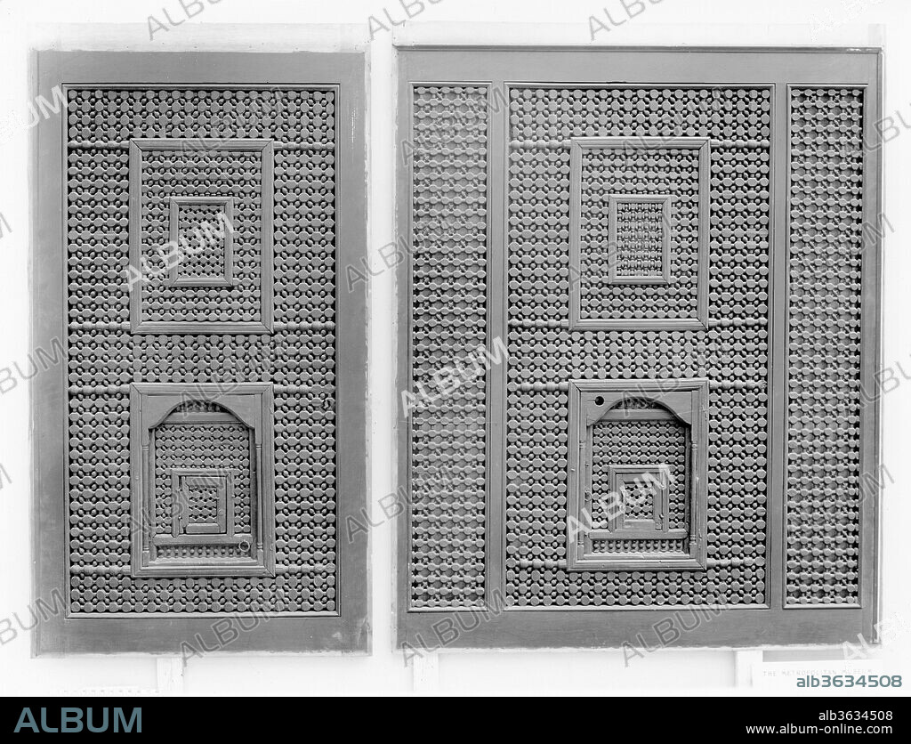 Mashrabiyya Screen. Dimensions: Screen a: H. 72 in. (182.9 cm)
 W. 36 in. (91.4 cm)
D. 2 in. (5.1 cm)
Screen b: H. 72 in. (182.9 cm)
 W. 54 in. (137.2 cm)
 D. 2 in. (5.1 cm). Date: 15th-16th century.
Mashrabiyya, or wooden window screens, usually have small windows from which the onlooker can see passersby without being seen or conduct a conversation with those outside. In these large mashrabiyya screen panels an example of such windows can be seen taking a horseshoe or curved arch shape.