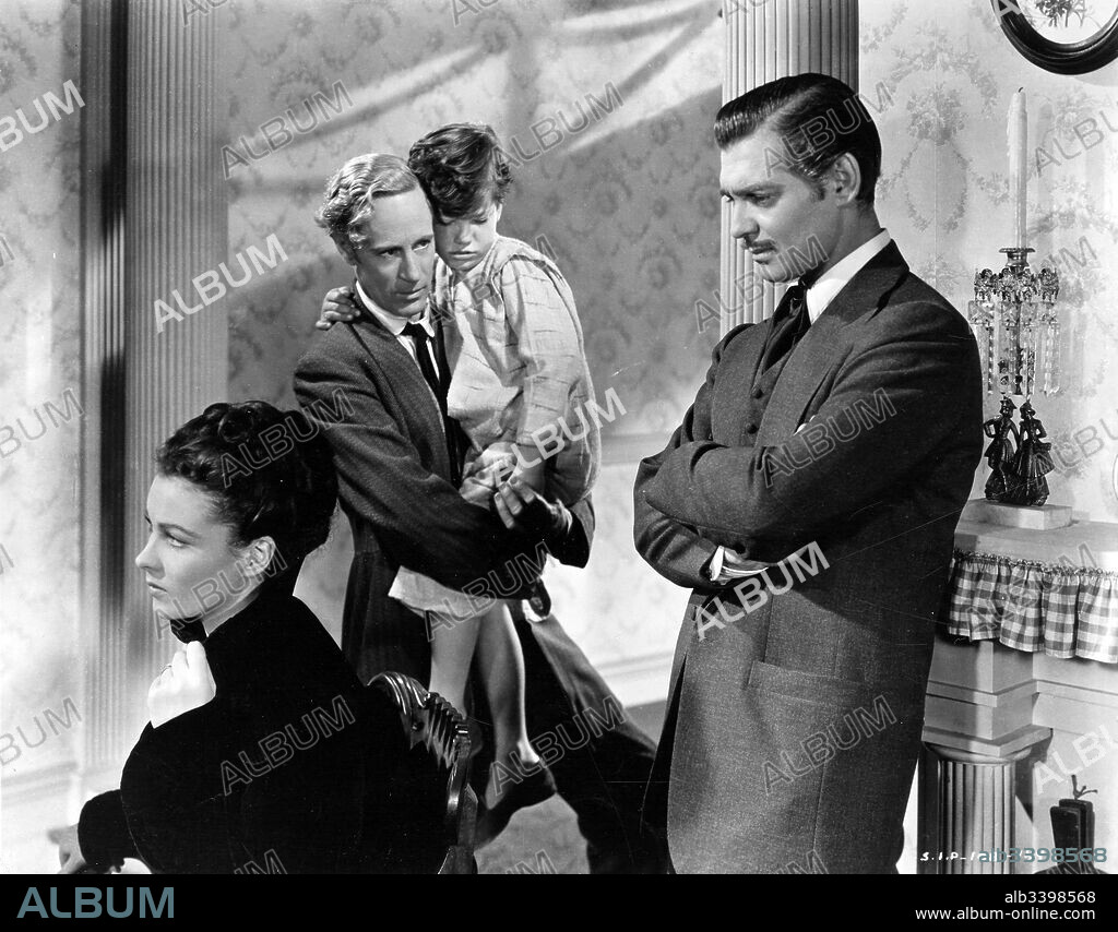 CLARK GABLE, LESLIE HOWARD and VIVIEN LEIGH in GONE WITH THE WIND, 1939, directed by GEORGE CUKOR and VICTOR FLEMING. Copyright M.G.M.