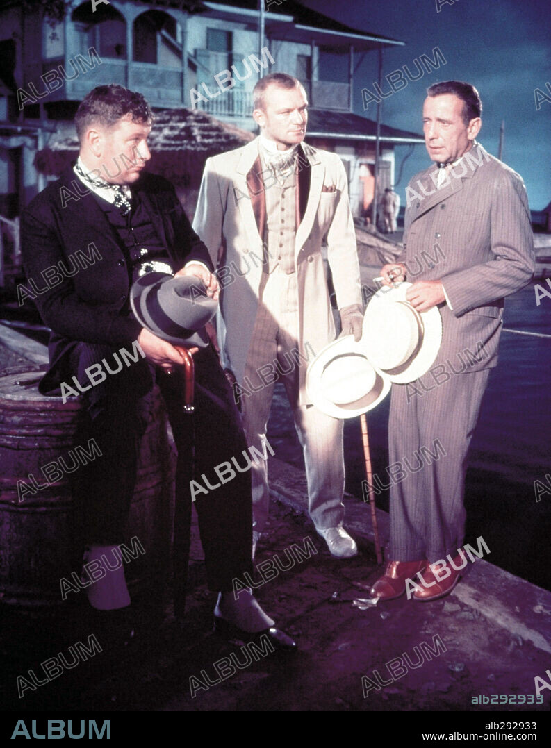 HUMPHREY BOGART, ALDO RAY and Sir Peter Ustinov. ALDO RAY, HUMPHREY BOGART and PETER USTINOV in WE'RE NO ANGELS, 1955, directed by MICHAEL CURTIZ. Copyright PARAMOUNT PICTURES.