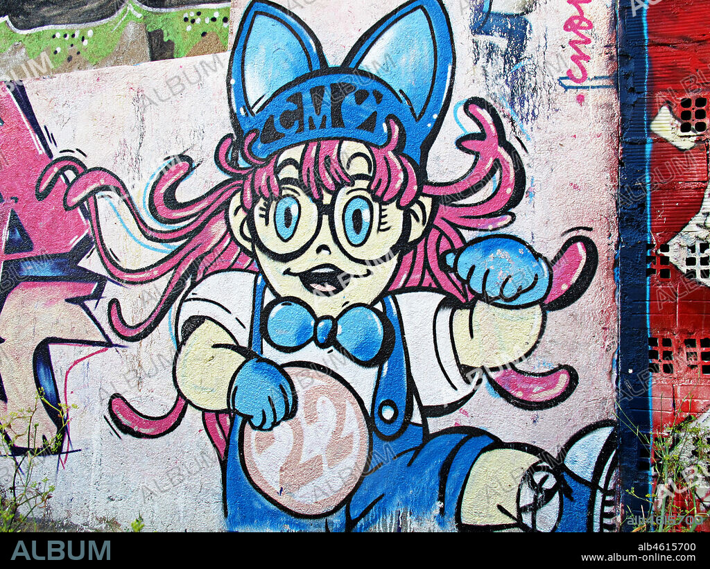 Ilustración de niña con gafas, cabello pelirrojo y expresión sonriente, graffiti mural, Mataró, provincia Barcelona, Barcelona en 2013.