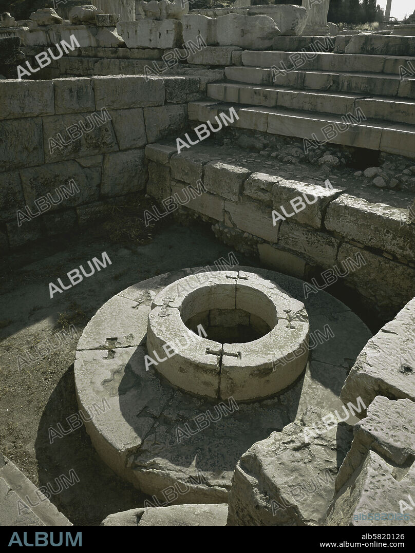 Sanctuary of Demeter, Eleusis. The sacred well Kalichoron " of the fair dances" around which the women of Eleusis danced in honour of Demeter, Goddess of the Earth and of fertility.