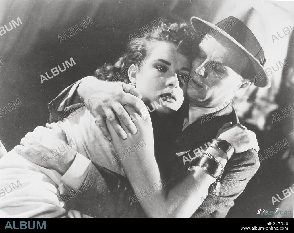 JEAN PETERS y RICHARD WIDMARK en MANOS PELIGROSAS, 1953 (PICKUP ON SOUTH STREET), dirigida por SAMUEL FULLER. Copyright 20TH CENTURY FOX.