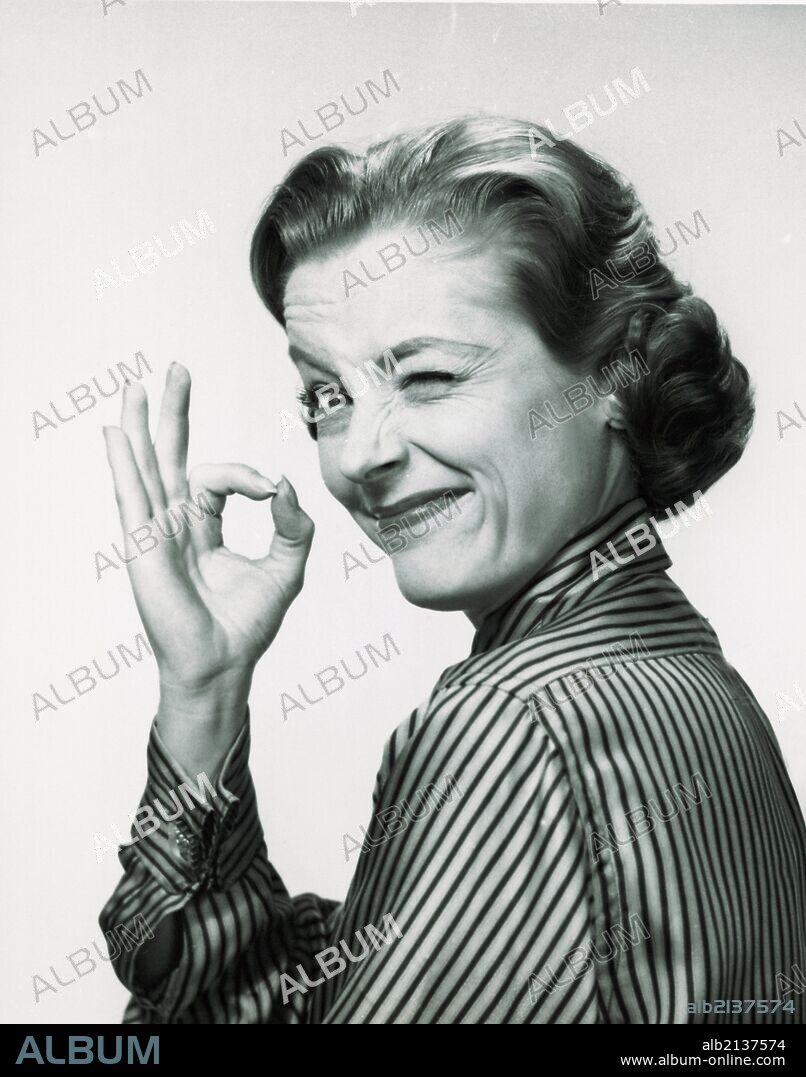 Woman making the okay gesture.