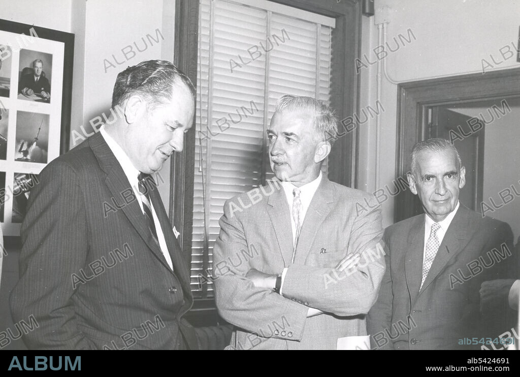 Final meeting of National Advisory Committee for Aeronautics, USA, August 21, 1958. Left to right: T. Keith Glennan, NASA Administrator; Mr. Preston R. Bassett, member of the NACA Committee on Aerodynamics; Mr. Charles J. McCarthy, Chairman of the Board, Chance Vought Aircraft, Inc. After the launch of the Soviet Union's Sputnik satellites in late 1957, the United States decided that it needed to re-organize civil space efforts. On July 29, 1958, President Dwight D. Eisenhower signed Public Law 85-568 and established the National Aeronautics and Space Administration (NASA). T. Keith Glennan was sworn in as the first Administrator of NASA on August 19, 1958, and on October 1, the official effective date of the new agency, NACA was absorbed into NASA, along with several other government space research organizations.
