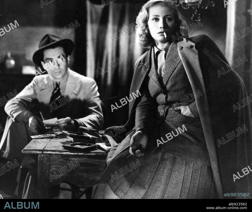 MICHELE ALFA and RAYMOND ROULEAU in L' AVENTURE EST AU COIN DE LA RUE, 1944, directed by JACQUES DANIEL-NORMAN.