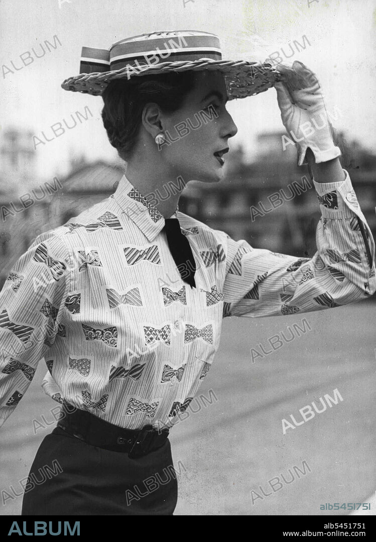Bows To Catch A ***** Eye -- Designer Digby Morton has made this very attractive ' Bow ' shirt for the overseas market, especially America. The latest style straw boater completes a delightful *****. April 13, 1954. (Photo by Paul Popper, Paul Popper Ltd.).