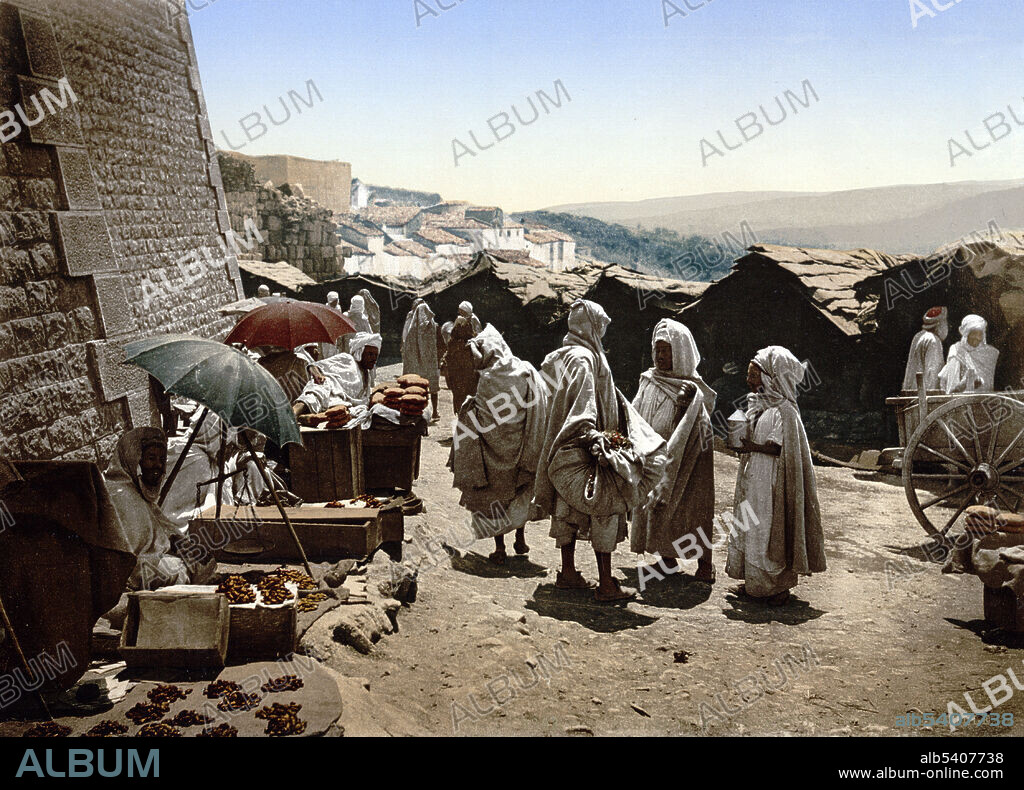 Constantine is the capital of Constantine Province in northeastern Algeria. Located somewhat inland, Constantine is about 50 miles  from the Mediterranean coast, on the banks of the tiny Rhumel River. During Roman times it was called Cirta and was renamed Constantina in honor of emperor Constantine the Great. In 1826 the last bey, Ahmed Bey ben Mohamed Chérif, became the new head of state. He led a fierce resistance against French forces, which had invaded Algeria four years later. By 1837, the territory was captured by France, and from 1848 on until 1962 it was an integral part of the French motherland. Constantine is often referred to as the City of Bridges due to the numerous picturesque bridges connecting the various hills, valleys, and ravines that the city is built on and around. Detroit Publishing Company, 1899.