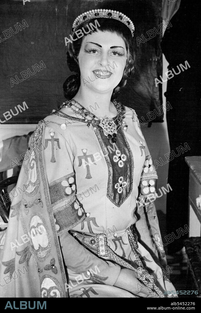Thrust Into Opera Stardom -- Two Excellent opera singers - Miss Rosina Raisbeck, who sang the part of 'Rotud' in 'Lonergrin' for the first time tonight at Covent Garden, London, in the absence of Edith Coates, in her dressing room before the performance -- both destined for eventual stardom had starring roles thrust on them at Covent Garden, London, tonight (Wednesday). They are Rosina Raisbeck, a dramatic soprano, and Thorsteinn Hannesson, a tenor. Both were in the cast, but were asked to take over the leads in the opera 'Lohengrin' when Edith Coates and Franz Lechleitner became suddenly ill with influenza Miss Raisbecdk joined the company after hare arrival from Australia in 1947. Mr. Hannesson came to England to study five years ago. February 8, 1950. (Photo by Reuterphoto).