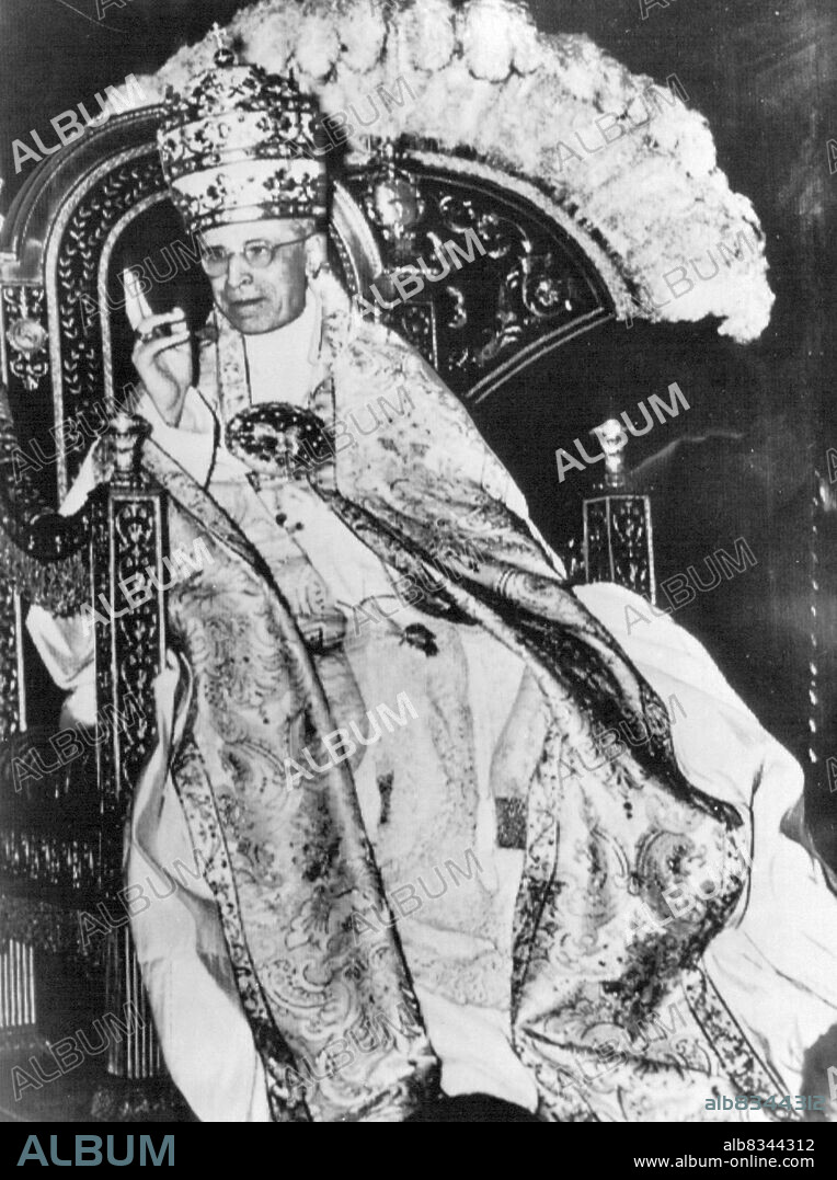 Sign of Recovery--Pope Pius XII, apparently over his gravest illness, blesses Vatican crowds gathered to honor him today on the 16th anniversary of his coronation. More than 5,000 pilgrims packed two antechambers of the Sistine Chapel to cheer the head of the Roman Catholic Church as he was carried by on his portable throne. It was the first time in three years that the Pope, now 79, was well enough to participate in a commemorative Ceremony. March 12, 1955. (Photo by AP Wirephoto).