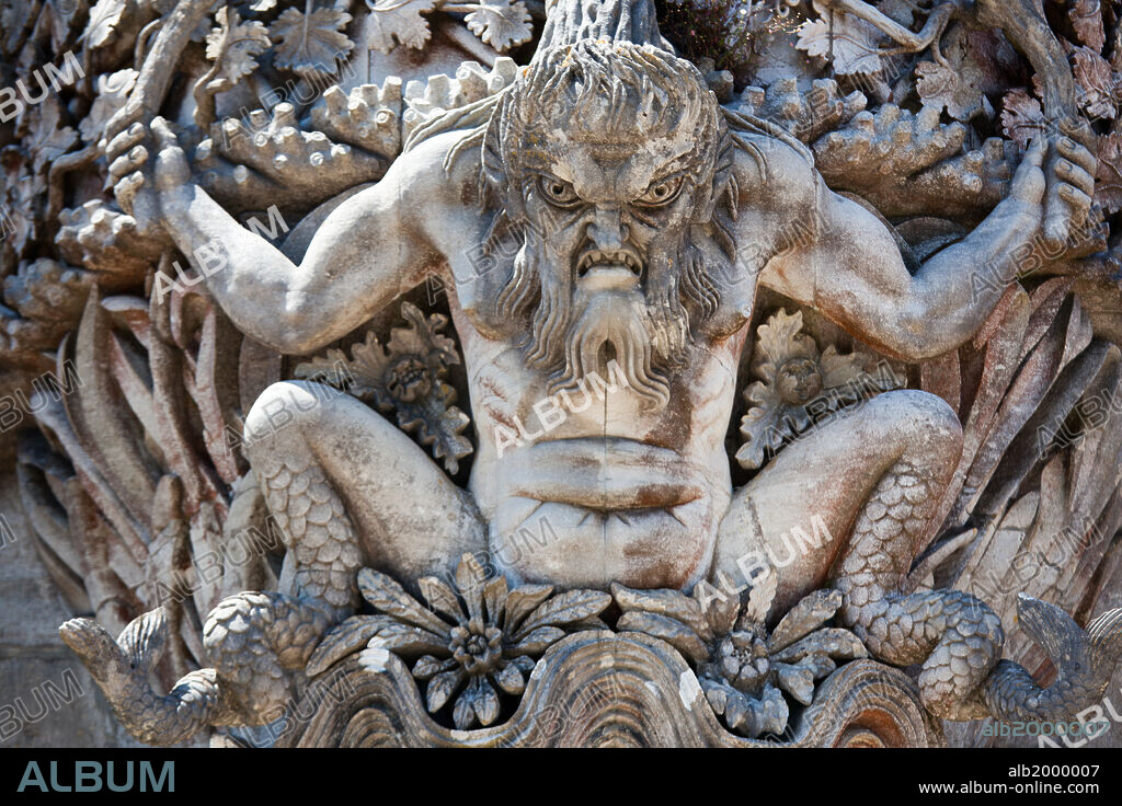 Portugal, Lisbon Region, Sintra, Pena National Palace, Gargoyle. The palace, which was built from 1842 to 1854 by the King Consort Ferdinand II, Queen Maria II and the Baron Von Eschwege, was inspired by European Romanticism and features a mixture of building styles that range from Moorish to pseudo-medieval. It is a fine example of 19th century Portuguese Romanticism.