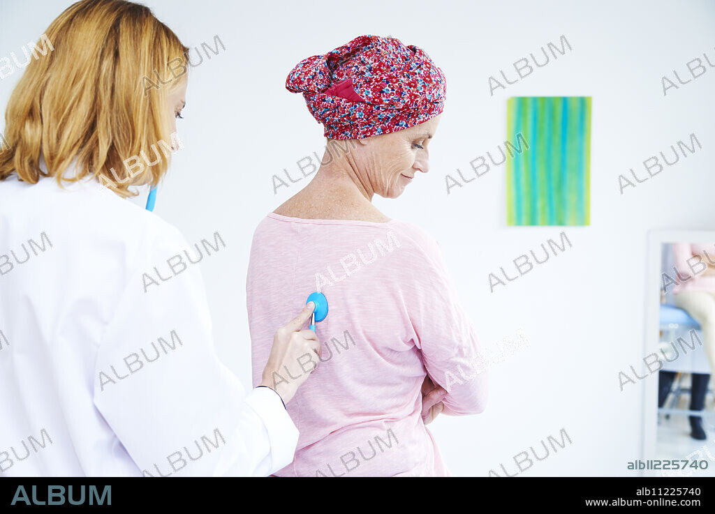 Doctor examining a woman with cancer.