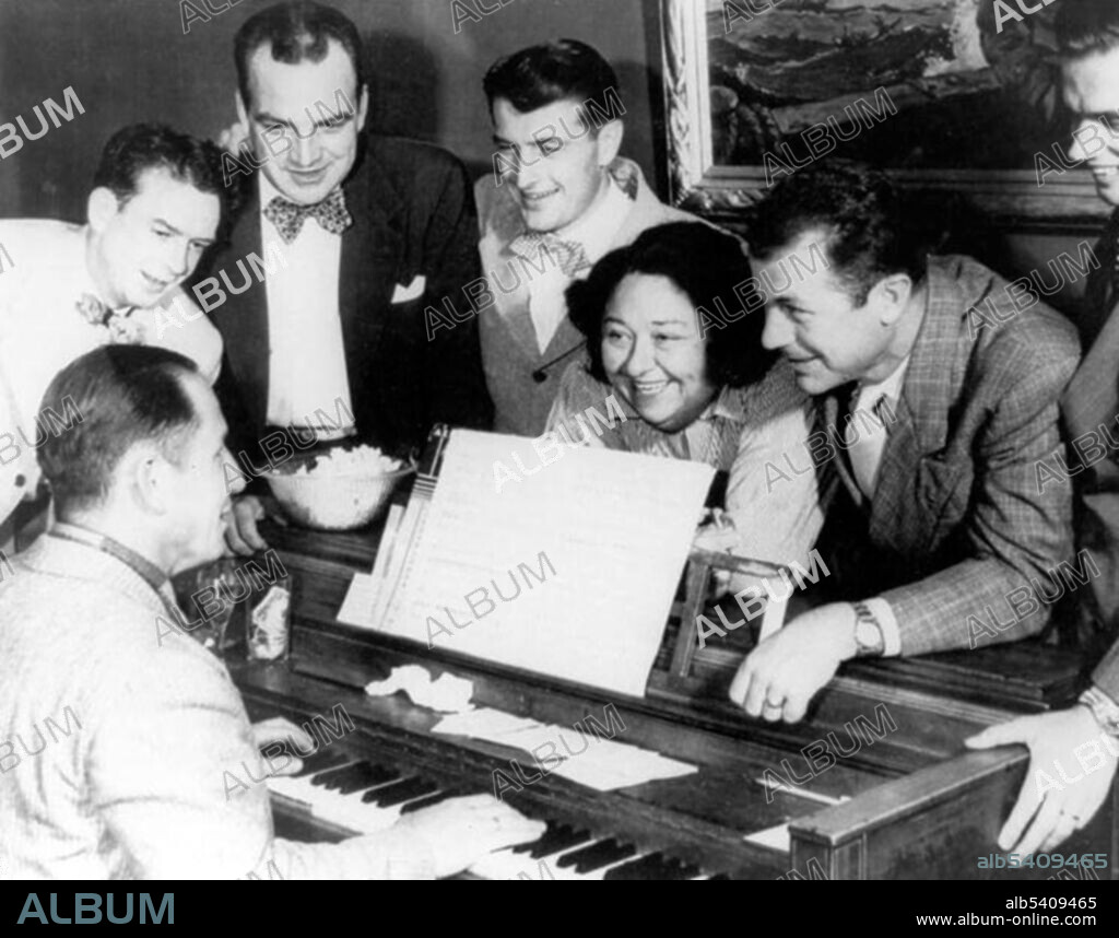 Barnes with unidentified men. Florence Lowe (Pancho) Barnes (July 22, 1901 - March 30, 1975) was a pioneer aviator, the founder of the first movie stunt pilots' union. In 1930, she broke Amelia Earhart's air speed record. Barnes raced in the Women's Air Derby and was a member of the Ninety-Nines. In later years, she was known as the owner of the Happy Bottom Riding Club, a bar and restaurant in the Mojave Desert, Southern California, catering to the legendary test pilots and aviators who worked nearby. Courtesy of USAF, undated (cropped and cleaned).