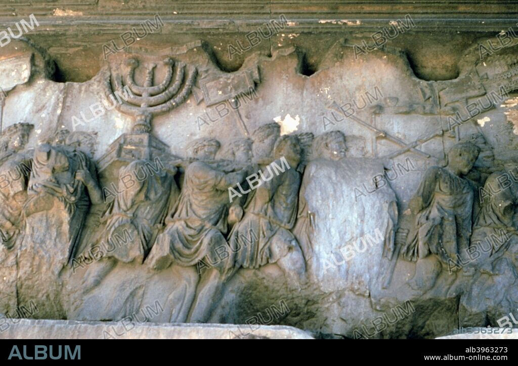 Arch of Titus, Rome, Italy, 1st century AD. The arch commemorates the capture and sack of Jerusalem by the Roman emperor Titus (39-81) in 70 during the Jewish revolt against Roman rule. This relief shows Romans carrying off treasures looted from the city. Titus was military commander in Judea at the time. He became emperor in 79 and the arch was built shortly after his death.