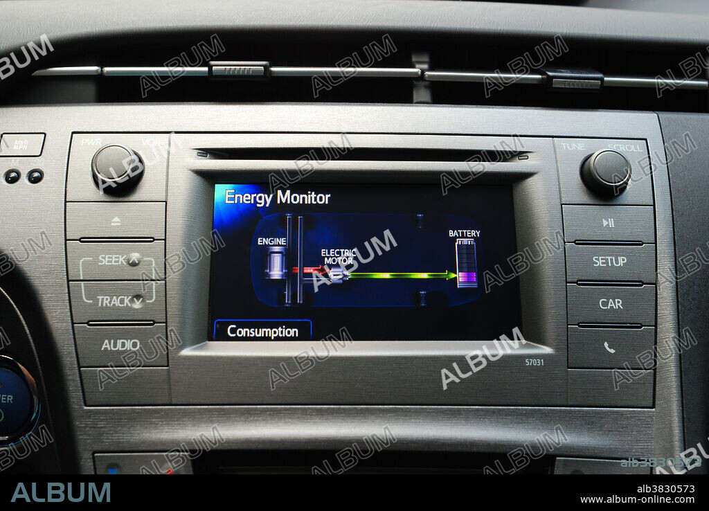 Energy Display of a Generation III Prius, showing the gas engine charging the main drive battery. Hybrid cars utilize a battery to store energy generated by braking and coasting and use it to drive an electric motor in tandem with a small gasoline engine. Together they provide power to drive the car, while using less gasoline than an internal combustion engine alone.