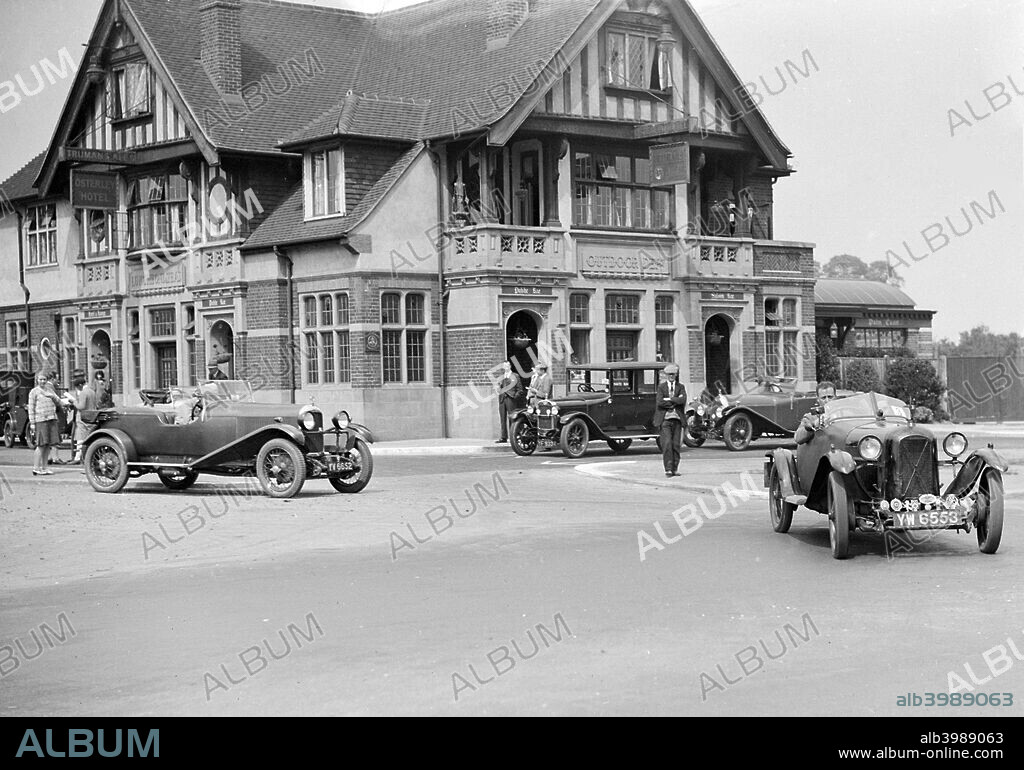 Salmson 1087 cc. Vehicle Reg. No.  YW6553.  No: 3 Driver: Rae, V.W. Left: Lagonda 1954 cc. Reg. No.  YV6652.   Entry No: 6 . Background: Austin  12/4 Vehicle Reg. No.  YF9334.  No: 28.  Osterley Park Hotel, Isleworth, Middlesex.  N.W. London M.C. Trial. Date: 1.6.29.