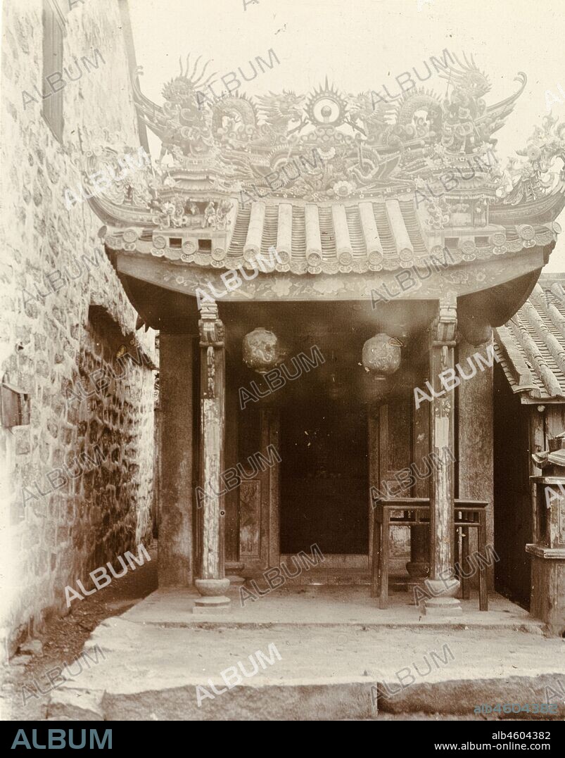 Hong KongChina, An ornate, pagoda-style roof, adorned with religious idols, decorates the doorway at the entrance to a 'Joss house'. Original manuscript caption: Joss House - specialty in roofs, circa 1903. 1998/028/1/1/48.
