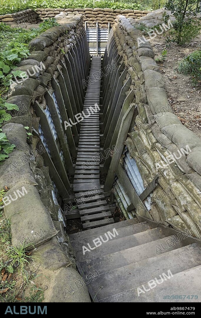 Reconstruction of British First World War One trench showing wooden duckboards on A frames, sandbags and sheets of corrugated iron at Zonnebeke, Belgium, Europe.
