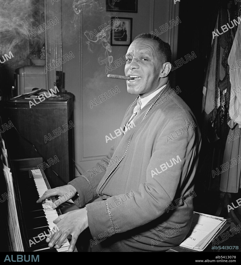 Willie Smith in his apartment, Manhattan, New York, N.Y., ca. Jan. 1947. William "The Lion" Smith (1893-1973) was an American jazz pianist and one of the masters of the stride style, usually grouped with James P. Johnson and Fats Waller as the three greatest practitioners of the genre in its golden age, from about 1920 to 1943.