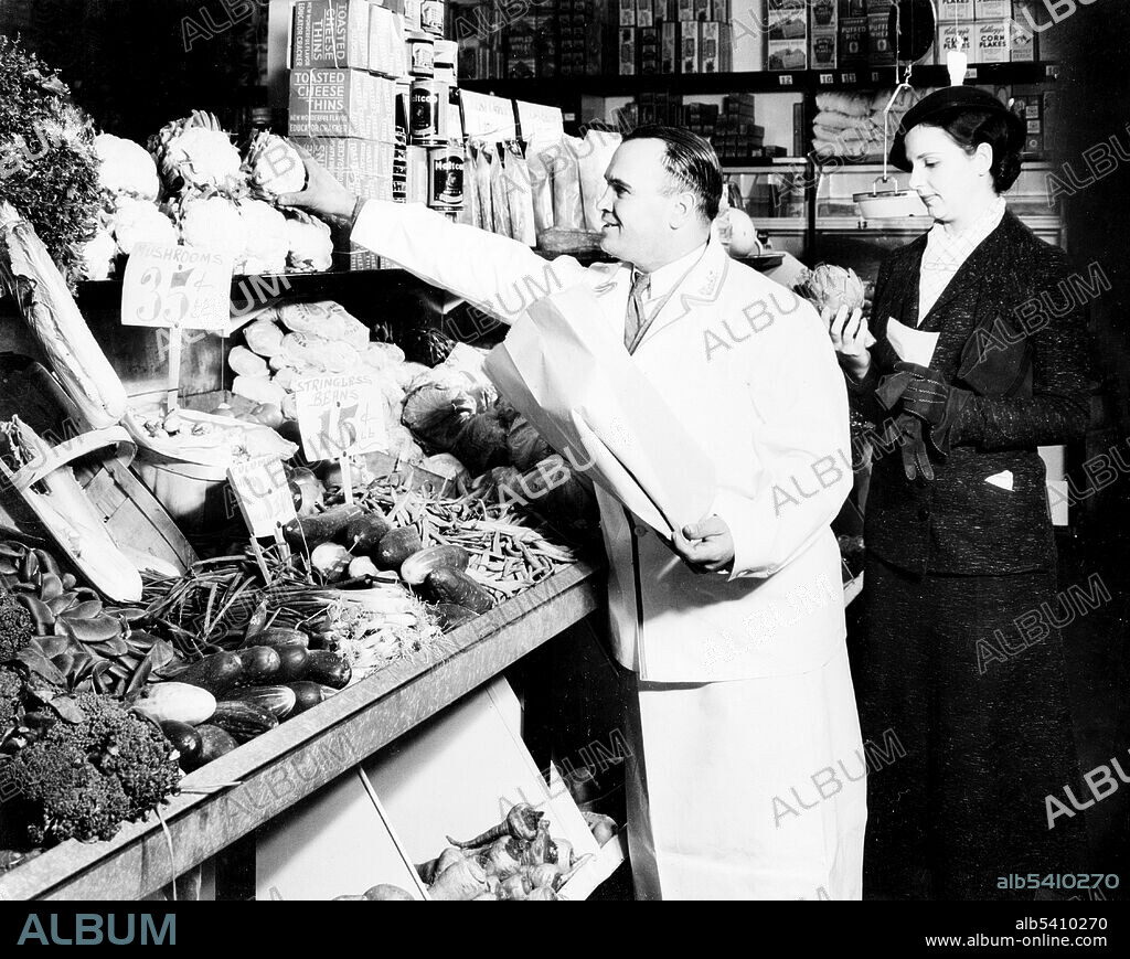 A grocery store is a retail shop that primarily sells food. A grocer is a bulk seller of food. Grocery stores also offer non-perishable foods that are packaged in bottles, boxes, and cans; some also have bakeries, butchers, delis, and fresh produce. Large grocery stores that stock significant amounts of non-food products, such as clothing and household items, are called supermarkets. Office of War Information, 1930s (cropped and cleaned).