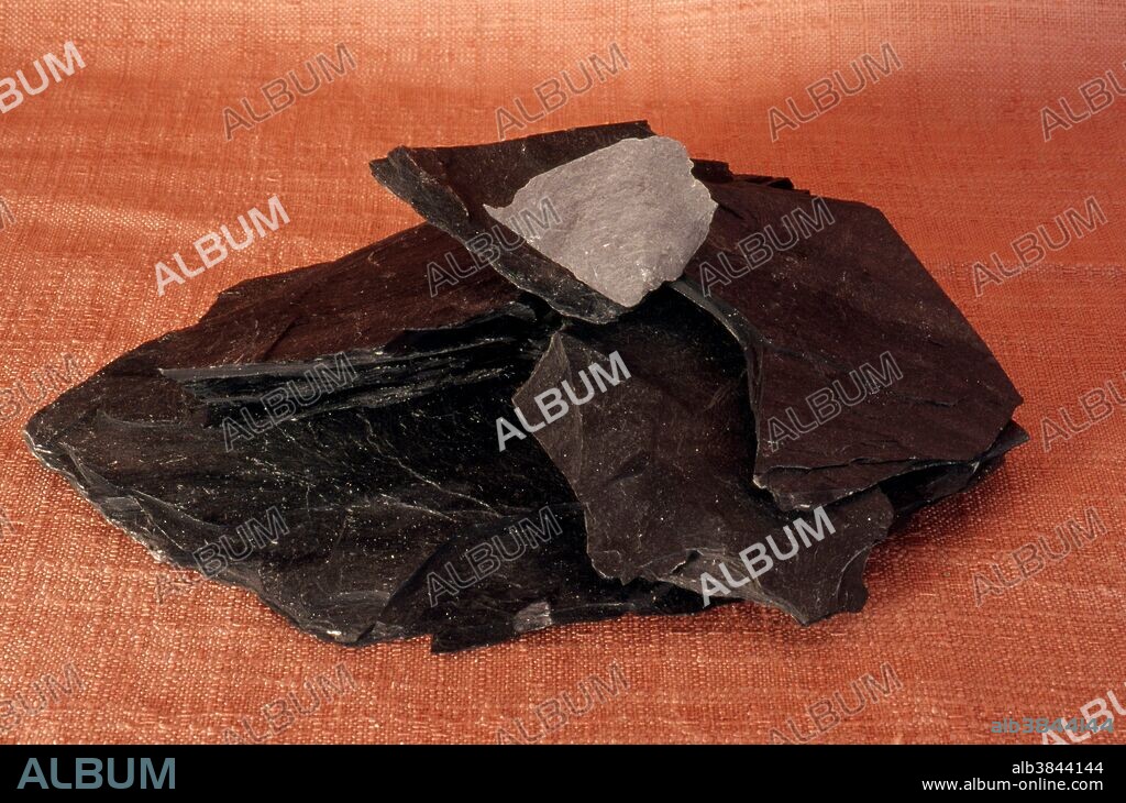 Slate, a metamorphic rock, made up of very fine sediments of clay, feldspar and quartz.