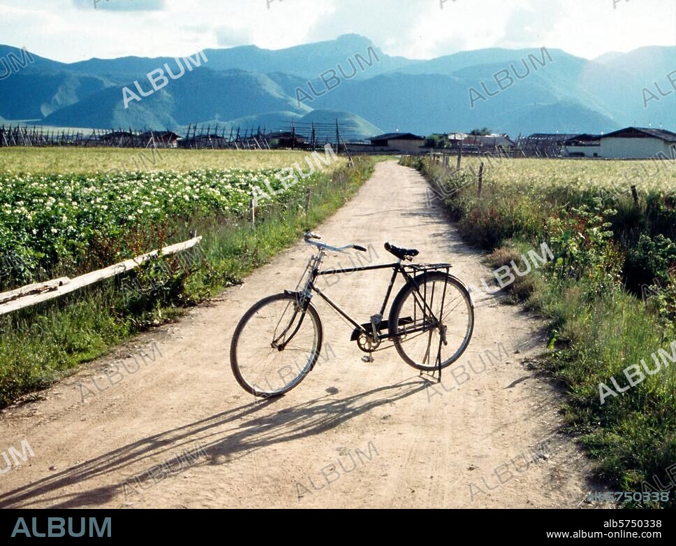 Transport / Bicycle. Deqin Autonomous Tibetan Prefecture, Yunnan Province, China: "Flying pigeon" bicycle on the road to a Tibean village. Photo, 2003.