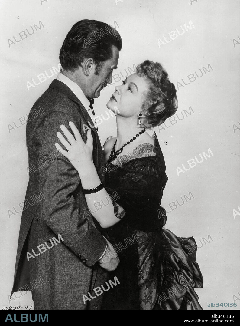 JO VAN FLEET and KIRK DOUGLAS in GUNFIGHT AT THE O. K. CORRAL, 1957, directed by JOHN STURGES. Copyright PARAMOUNT PICTURES.